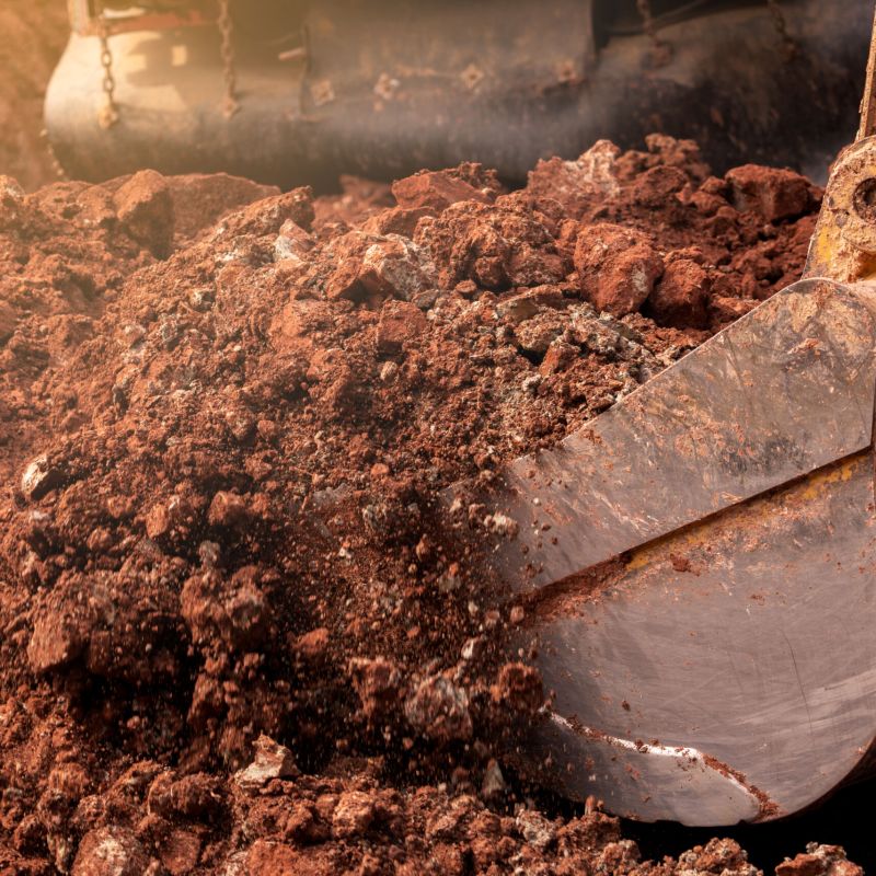 Closeup,Bucket,Of,Backhoe,Digging,The,Soil,At,Construction,Site.
